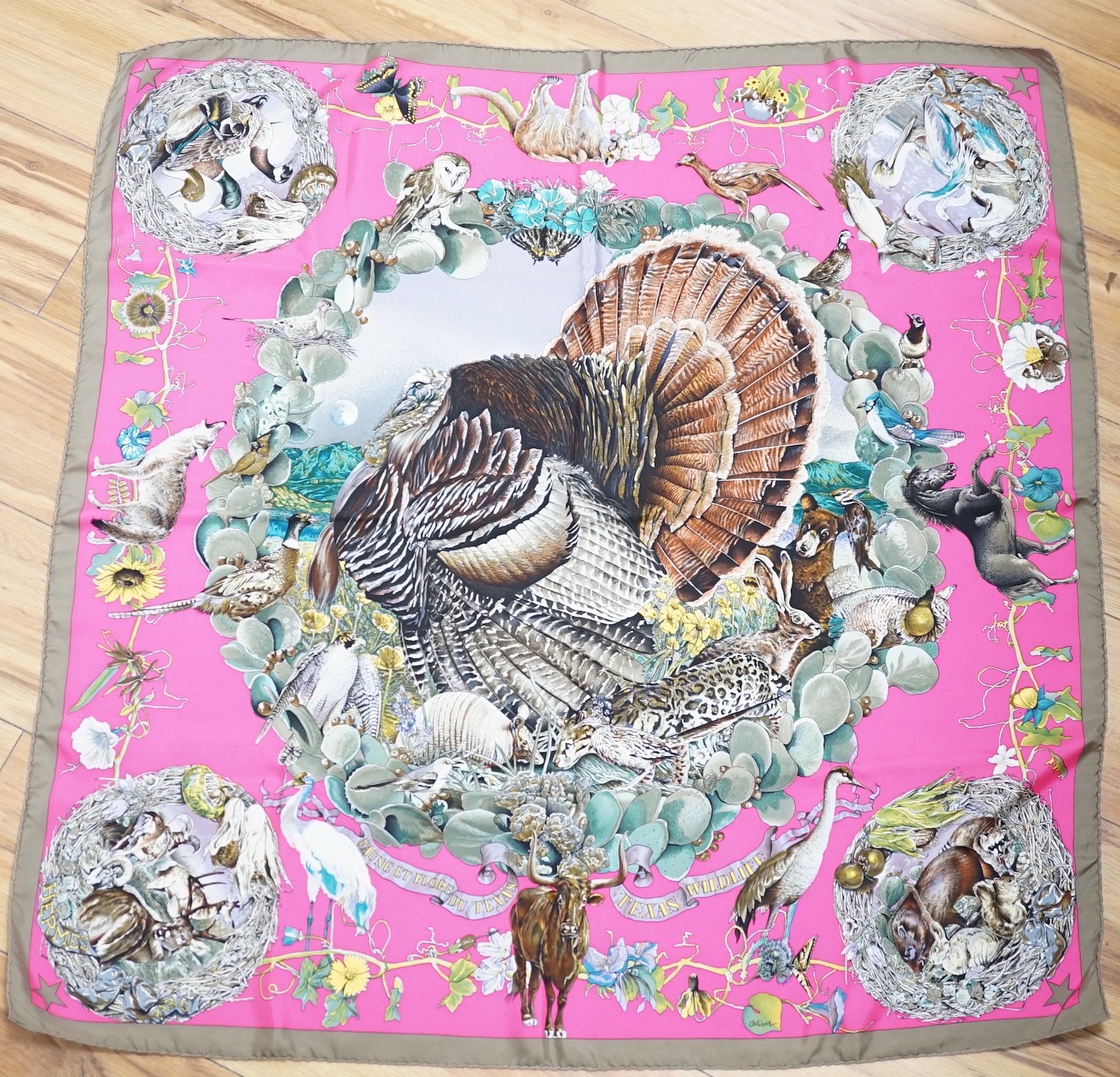 A Lady’s Hermes ‘Faune Et Flore Du Texas, Texas Wildlife’ silk scarf, designed by Oliver Kermit, in original box, with a cased wooden scarf ring
